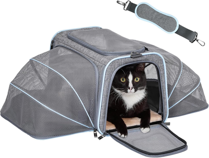 Black and white cat in gray mesh pet carrier with shoulder strap, ideal for travel and comfort